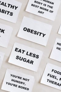 Obesity and Eat Less Sugar post-it notes