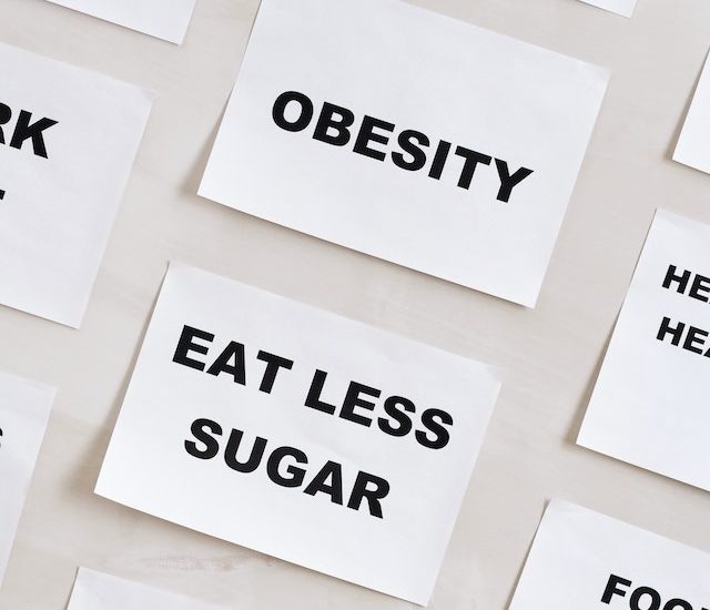 Obesity and Eat Less Sugar post-it notes